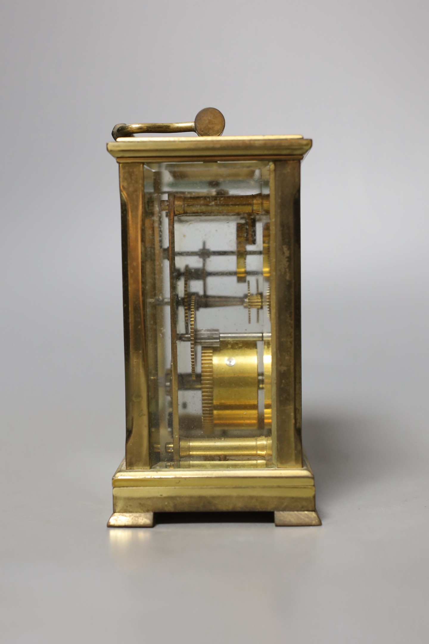 A Dent retailed brass carriage timepiece, 12 cms high.